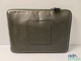 a large grey leather bag with a zipper on the front