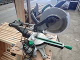 someone is using a circular saw to cut a piece of wood