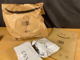 a brown bag and some white bags on a table