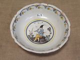 a small bowl with a picture of a boy on it