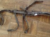 a very old gun that is laying on the floor