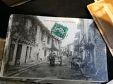 an old photo of a horse drawn carriage on the street