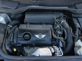 the engine of a car with its hood open and the hood down