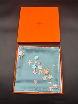 an orange box with a blue and white floral design on it