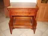 a small wooden table with a drawer underneath it
