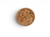 a penny on a white surface with a white background