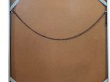 an image of a cork board with a white frame and silver trim
