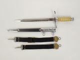 three different types of swords on a white surface