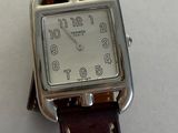 a watch that is sitting on a table with a price tag