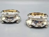 pair of silverplated candlesticks with ornate design