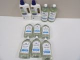 several bottles of hand sanitizer sitting on a counter top