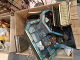 a cardboard box full of assorted items on the floor