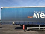 a semi truck that is parked in a parking lot