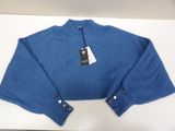 the sweater is blue and has a tag on it