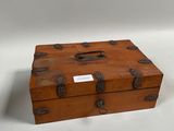 a small wooden box sitting on a white surface