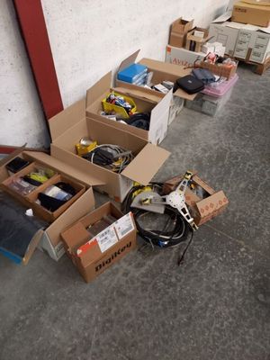 many boxes of assorted items sitting on the floor