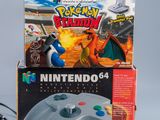 two nintendo 64 game controllers sitting next to each other on a table