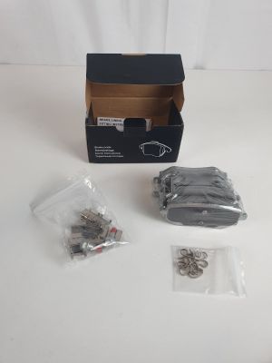 a box of screws and nuts sitting on a table
