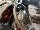 dashboard of a car with a steering wheel and dashboard lights