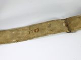 a belt with a number on it on a white surface