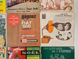 a lot of books that are on the table