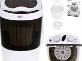 an image of a small washing machine with a basket