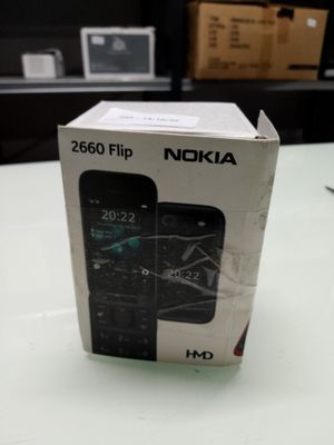 boxed box of nokia flip phone sitting on a table in a room