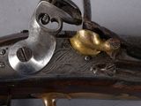 a close up of a gun that is on display