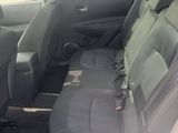the back seats of a car are empty in a parking lot