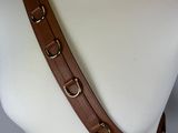 a close up of a mannequin torso wearing a brown leather belt