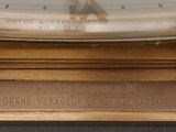 a close up of a clock on a table