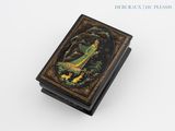 a black box with a painting of a woman and a bird on it