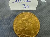 a close up of a gold coin with a label on it