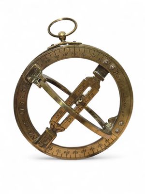 an old brass compass on a white background with a white background