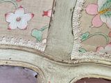 a close up of a chair with a floral pattern on it