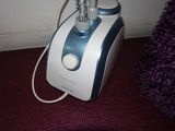 a blender that is sitting on the floor next to the wall