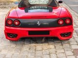 a red sports car parked on the side of the road