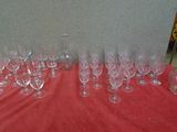 many empty wine glasses sitting on a red table