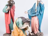 three figurines of jesus, mary, and jesus on a white background