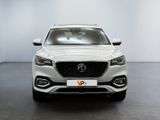 the front view of a white suv parked in a room