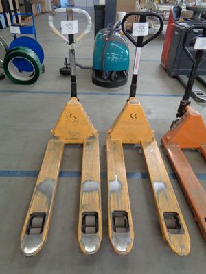 four skis that are sitting on the floor in a warehouse