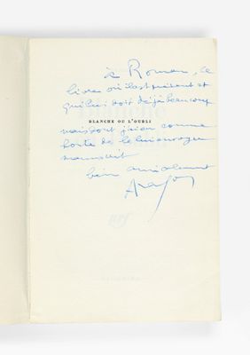 un gros plan d'un livre sur lequel figure une note manuscrite