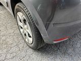 a close up of a car ' s tire on the street