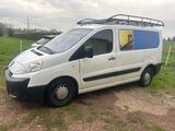 a white van that is parked on the side of the road