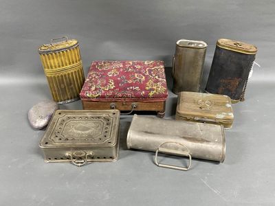 several different types of tins and other metal items on a table