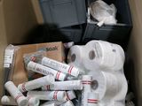 many rolls of toilet paper in a cardboard box
