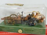 a small model of a steam engine in a glass case