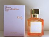 an image of a bottle of perfume sitting next to a box of perfume