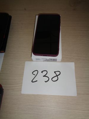 several cell phones are sitting on a table with a price tag