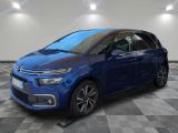 a blue citrole is parked in a room with a checkered floor